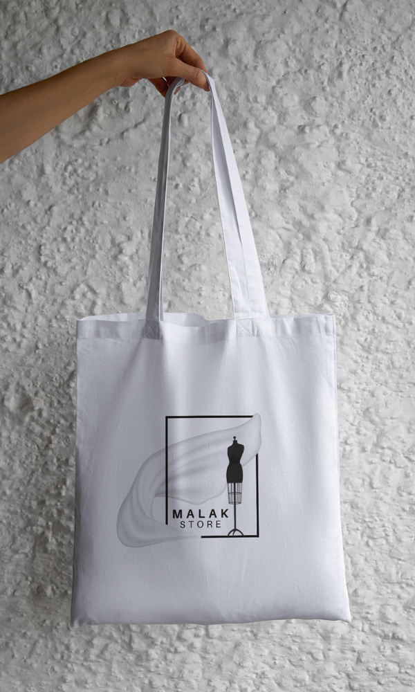 tote bag with printed logo in the front designed for a local clothing shop by rola khader